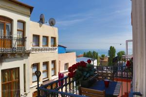 a balcony of a building with flowers on it at Catirga Konak Apartments in Istanbul