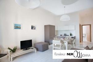 TV a/nebo společenská místnost v ubytování NerOssidiana sul mare di Lipari