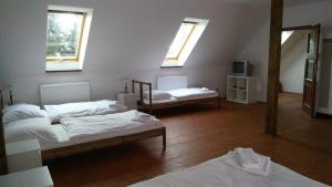 Postel nebo postele na pokoji v ubytování Hotel U Zeleneho stromu