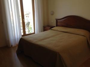 Postel nebo postele na pokoji v ubytování Hotel Belvedere