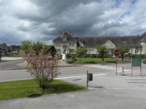 a house on a street with a stop sign at Le Breuil in Piney
