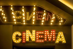 a neon sign that says love with lights on it at Mava Apartamente in Constanţa