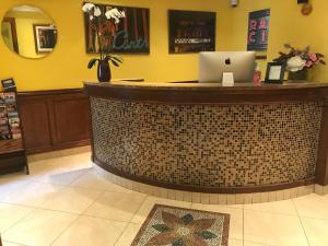 a bar in a store with a laptop on it at Chelsea Pines Inn in New York