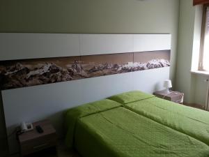 Postel nebo postele na pokoji v ubytování Albergo Carla