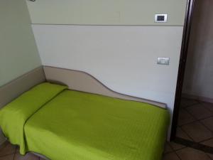 Postel nebo postele na pokoji v ubytování Albergo Carla