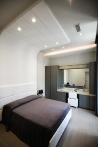 Säng eller sängar i ett rum på Gramsci Luxury Rooms