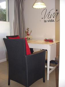 a white desk with two chairs and a white table at Apartment Am Markt 13 in Konz