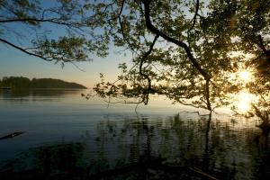 a view of a lake with the sun setting at Lee ZEN in Leezen