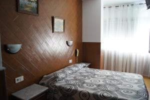 Postel nebo postele na pokoji v ubytování Hostal Sanmar