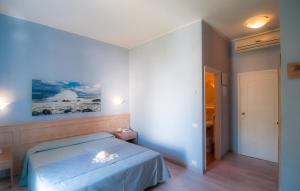 Postel nebo postele na pokoji v ubytování Hotel Marelba