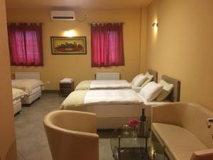 Postel nebo postele na pokoji v ubytování Hotel Portal