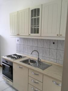 Kuchyňa alebo kuchynka v ubytovaní Apartments Banic