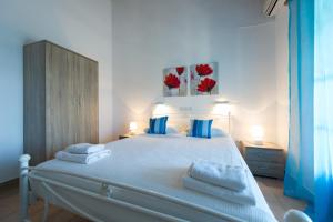 Posteľ alebo postele v izbe v ubytovaní Renata Rooms & Studios