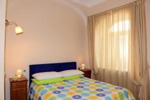 מיטה או מיטות בחדר ב-Appartamento La Corallina