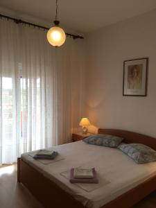 Posteľ alebo postele v izbe v ubytovaní Apartments Banic
