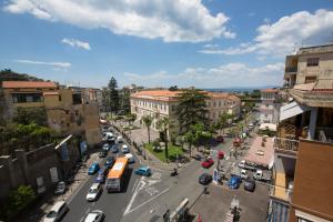 a city street with cars and a bus at La Piazza in Sant'Agnello