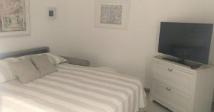 A television and/or entertainment centre at Aia dei Limoni
