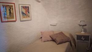 A bed or beds in a room at Aia dei Limoni