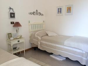 A bed or beds in a room at Aia dei Limoni