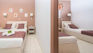 Posteľ alebo postele v izbe v ubytovaní Blue House Apartments