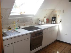 a kitchen with a sink and a window at Apartment Monika in Frechen