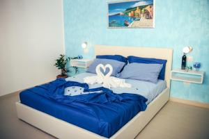 Postel nebo postele na pokoji v ubytování Il Sorriso B&B