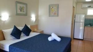 Postel nebo postele na pokoji v ubytování Cairns Gateway Resort + 37 fotografií