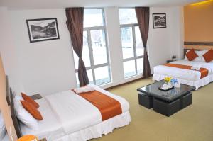 Katil atau katil-katil dalam bilik di Hotel Double Stars Cameron Highlands