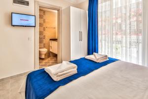 Postel nebo postele na pokoji v ubytování Kaş Artemis Hotel