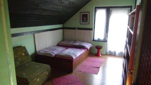 Кровать или кровати в номере Ciklámen vendégházak