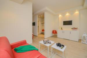 Televízia a/alebo spoločenská miestnosť v ubytovaní Hotel Villa Garuti