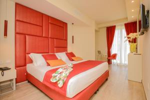 Posteľ alebo postele v izbe v ubytovaní Hotel Villa Garuti