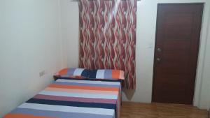 Letto o letti in una camera di Budget Studio Unit in Makati