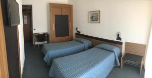 Postel nebo postele na pokoji v ubytování Albergo Valle d'Oro