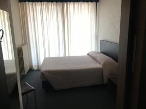 Postel nebo postele na pokoji v ubytování Albergo Valle d'Oro