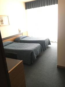 Postel nebo postele na pokoji v ubytování Albergo Valle d'Oro