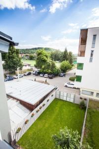 an aerial view of a building with a green yard at Haas Apartments in Brno