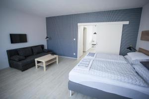 Posteľ alebo postele v izbe v ubytovaní Haas Apartments