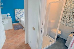 a shower in a bathroom with a toilet at Affittacamere Caffè Nazionale in Stresa