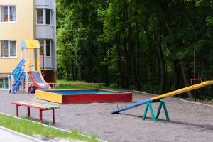 a playground with colorful play equipment in a park at NEW Apartment on Zhasmynova Street 5b in Lviv