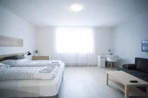 Posteľ alebo postele v izbe v ubytovaní Haas Apartments