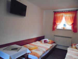 A bed or beds in a room at Agroturystyka Krysia Pilszcz
