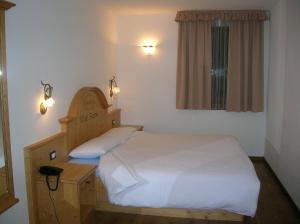 Postel nebo postele na pokoji v ubytování Hotel Villa Fosine