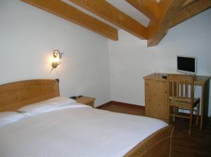Postel nebo postele na pokoji v ubytování Hotel Villa Fosine