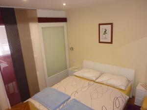Postel nebo postele na pokoji v ubytování Guest House Mireja