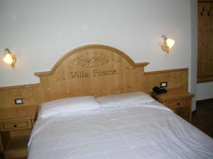 Postel nebo postele na pokoji v ubytování Hotel Villa Fosine