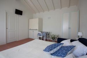 מיטה או מיטות בחדר ב-Casali Romei