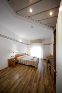 Postel nebo postele na pokoji v ubytování Hotel Marina Bay