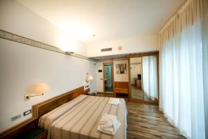 Postel nebo postele na pokoji v ubytování Hotel Marina Bay