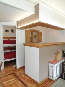 a kitchen with a counter top in a room at Bilocale Alberti - Gran Baita in Madonna di Campiglio